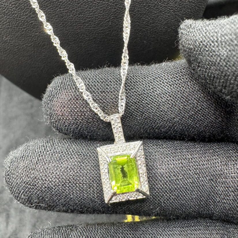 9ct Gold Peridot & Diamond Halo Pendant Necklace (Emerald Cut), photographed by NTB Jewellers
